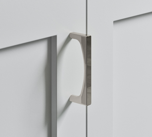 The Top Knobs Riverside pull in a Polished Nickel finish.